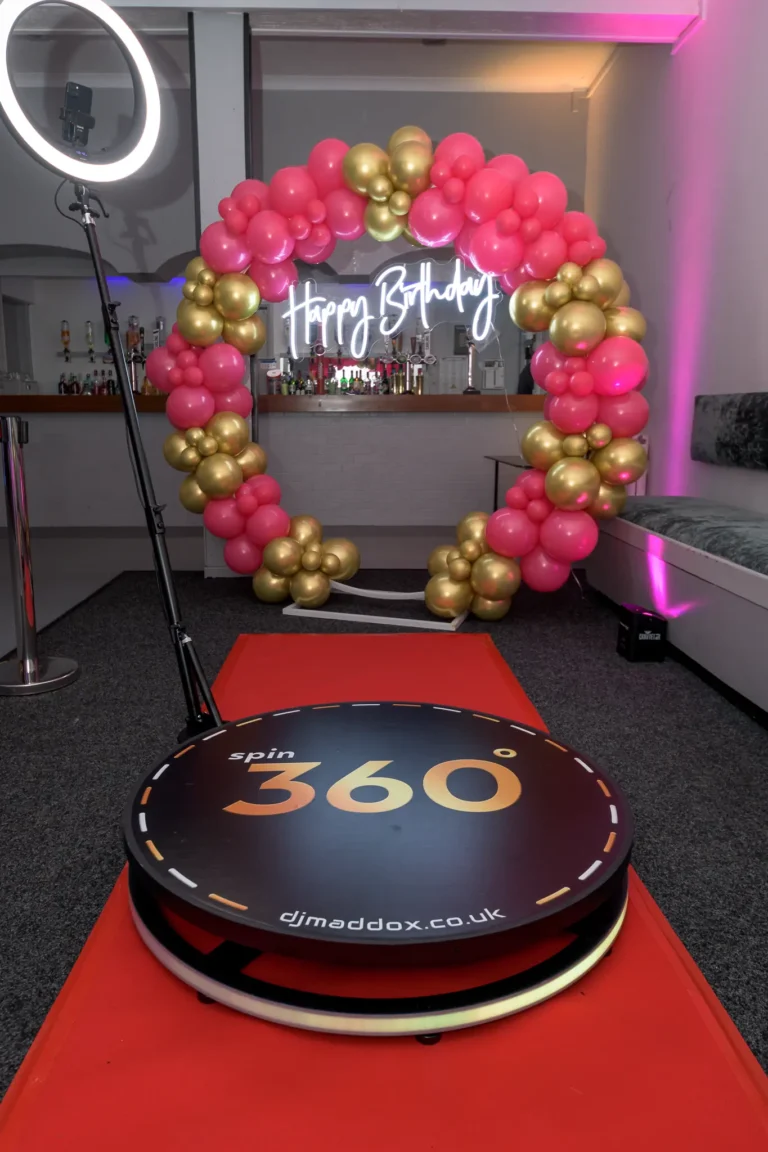 360 Photo Booth hire setup at birthday party in Swansea with colourful balloons in the background