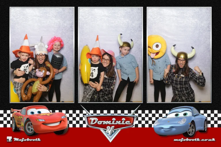 Picture taken by photo booth mirror encapsulated in children's themed cars template. Childs birthday party guests smiling for the camera.